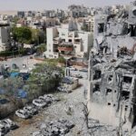 Israel hits Iran with waves of attacks and says it killed top Hezbollah commander